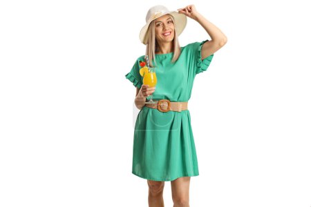 Photo for Woman in a green dress holding a glass of cocktail isolated on white background - Royalty Free Image