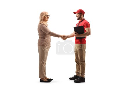 Photo for Woman shaking hands with a courier isolated on white background - Royalty Free Image