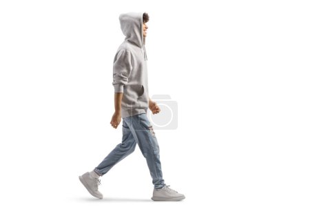 Photo for Full length shot of a tall guy wearing a gray hoodie and walking isolated on white background - Royalty Free Image