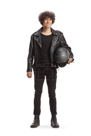 Photo for Full length portrait of a young man in a leather jacket holding a helmet and smiling isolated on white background - Royalty Free Image