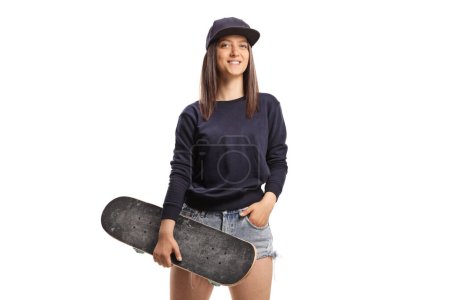 Photo for Skater girl holding a skateboard isolated on white background - Royalty Free Image