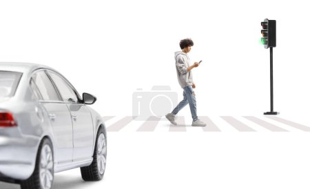 Photo for Guy in a gray hoodie crossing a street with a smartphone in his hands isolated on white background - Royalty Free Image