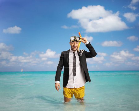 Photo for Businessman standing in the sea in swimming shorts and suit with tie - Royalty Free Image