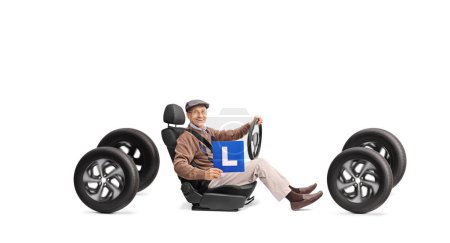 Photo for Cheerful senior holding a learner plate and driving on four wheels isolated on white background - Royalty Free Image