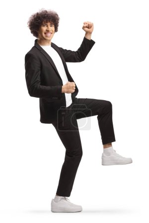 Photo for Full length shot of a tall guy dancing isolated on white background - Royalty Free Image
