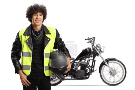 Téléchargez les photos : Biker holding a helmet and wearing a traffic safety vest isolated on white background - en image libre de droit