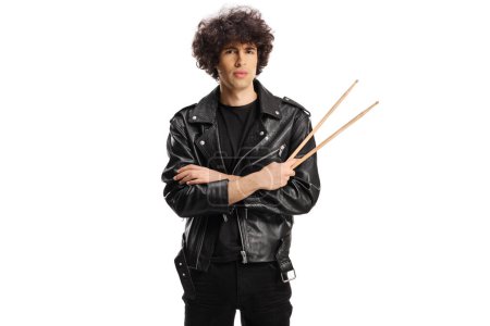Téléchargez les photos : Young drummer standing and holding a pair of drumsticks isolated on white baackground - en image libre de droit