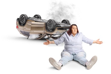 Foto de Angry woman sitting in front of a car crash isolated on white background - Imagen libre de derechos