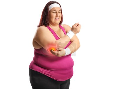 Photo for Plus size woman in sportswear with painful elbow isolated on white background - Royalty Free Image