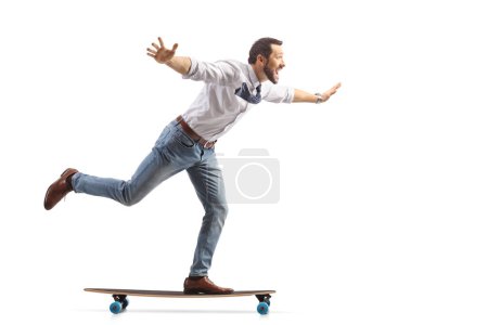 Photo for Joyful professional man riding on a skateboard isolated on white background - Royalty Free Image