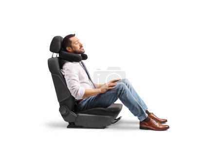 Photo for Passenger in a car seat with a travel pillow around neck isolated on white background - Royalty Free Image