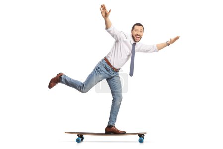 Photo for Excited young businessman riding on a skateboard isolated on white background - Royalty Free Image