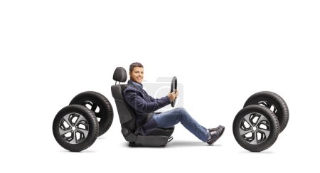 Photo for Full length profile shot of a man in a car seat driving on four tires isolated on white background - Royalty Free Image