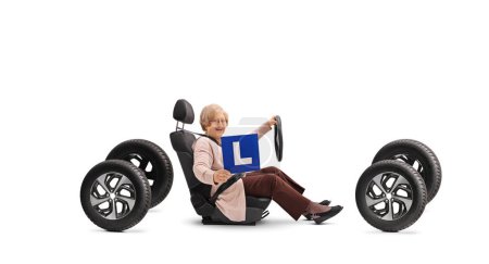 Photo for Elderly woman learning to drive a car isolated on white background - Royalty Free Image