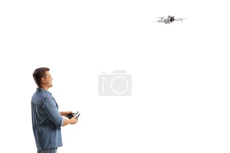 Photo for Guy flying a drone isolated on white background - Royalty Free Image