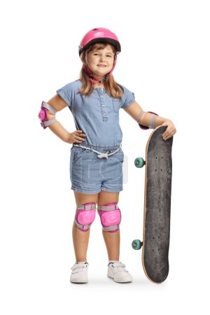 Photo for Girl with a skateboard, elbow and knee pads and helmet smiling at camera isolated on white background - Royalty Free Image