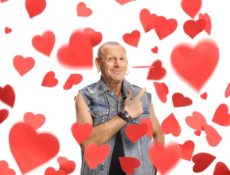 Photo for Cheerful bald man pointing at falling red hearts isolated on white background - Royalty Free Image