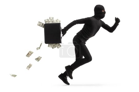 Foto de Foto de perfil completo de un ladrón corriendo con dinero en un maletín aislado sobre fondo blanco - Imagen libre de derechos