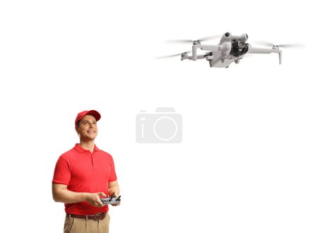 Photo for Operator flying a drone with a remote controller isolated on white background - Royalty Free Image