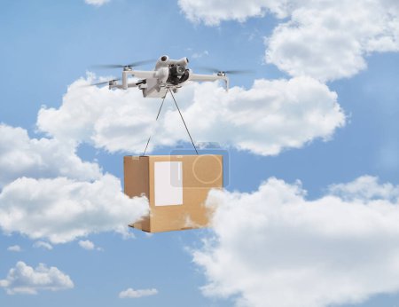 Photo for Drone delivering a cardboard box and flying in the sky - Royalty Free Image