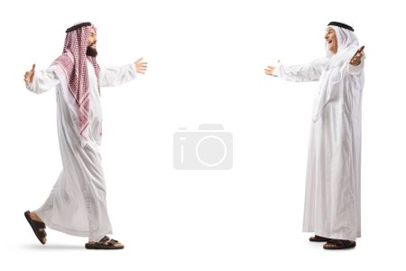 Photo for Full length profile shot of two muslim men meeting each other isolated on white background - Royalty Free Image