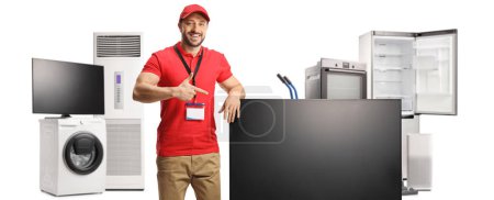 Photo for Salesman pointing at a flat lcd tv screen and other home appliances isolated on white background - Royalty Free Image