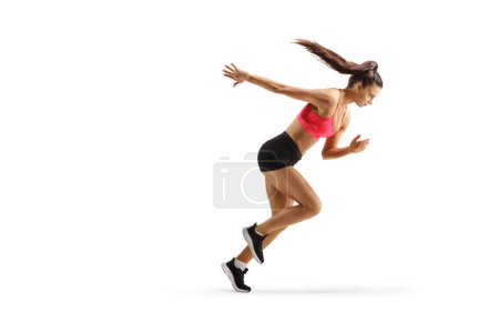Foto de Imagen de perfil de longitud completa de una joven en forma de mujer corriendo aislada sobre fondo blanco - Imagen libre de derechos