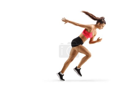 Téléchargez les photos : Photo de profil pleine longueur d'une belle athlète féminine qui court isolée sur fond blanc - en image libre de droit