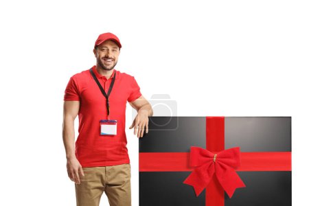 Photo for Salesman with a flat lcd tv screen tied with a red ribbon isolated on white background - Royalty Free Image