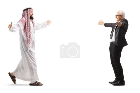 Photo for Full length profile shot of a saudi arab man meeting a mature businessman isolated on white background - Royalty Free Image