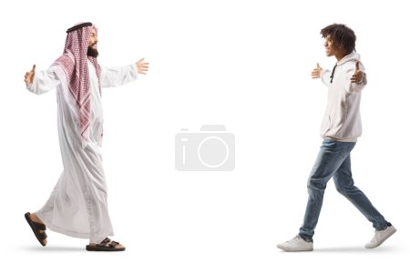 Photo for Full length profile shot of a saudi arab man meeting a young african american man isolated on white background - Royalty Free Image
