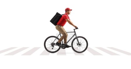 Food delivery guy on a bicycle riding at a pedestrian crossing isolated on white background