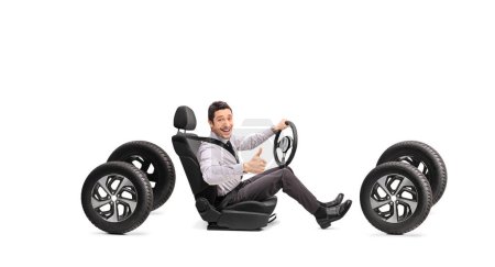Photo for Guy sitting in a driver car seat and gesturing thumbs up isolated on white background - Royalty Free Image