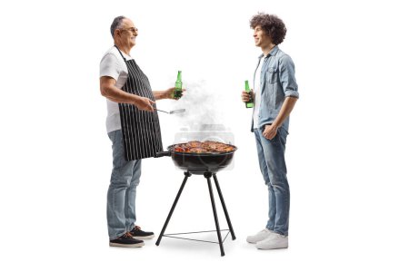 Photo for Mature man grilling at a bbq and talking to a young man  isolated on white background - Royalty Free Image