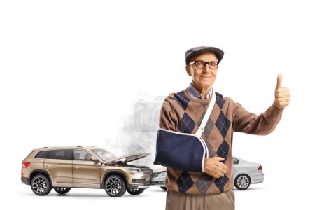 Car collision and an elderly man with a broken arm gesturing thumbs up isolated on white background