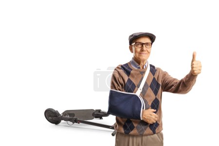 Elderly man with a broken arm gesturing thumbs up isolated on white background, electric scooter accident concept