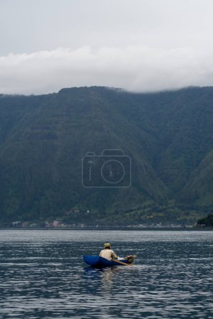Photo for View of the horizon of lake toba in the morning with cloudy weather - Royalty Free Image