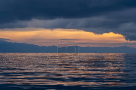 Photo for View of the horizon of lake toba in the morning with cloudy weather - Royalty Free Image
