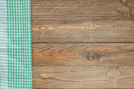 Photo for Wood texture with green squared textile napkin, top view, horizontal - Royalty Free Image