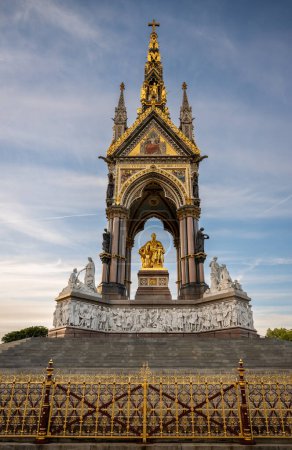 Photo for London, UK: The Albert Memorial in Kensington Gardens in memory of Prince Albert, the husband of Queen Victoria. South view with decorative railings in foreground. - Royalty Free Image