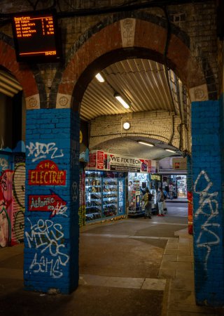 Photo for Brixton, London, UK: Subway beneath Brixton railway station at night with colorful art. - Royalty Free Image