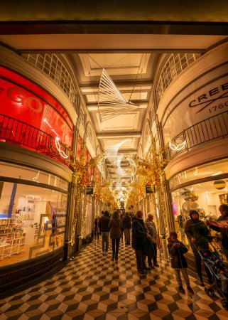 Photo for London, UK - Nov 20 2023: Quadrant Arcade, a chic retail complex with upscale shops adjoining Regent Street in central London. Seen with illuminations and Christmas decorations. - Royalty Free Image