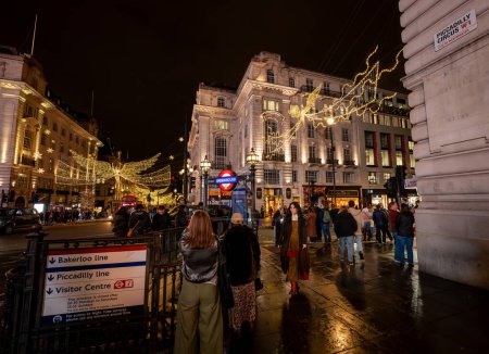 Photo for London, UK - Nov 20 2023: People around the entrance to Piccadilly Circus underground station in central London. This entrance is at the junction of Piccadilly and Piccadilly Circus. - Royalty Free Image