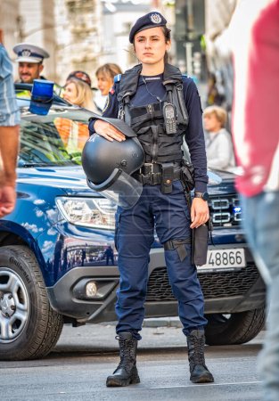 Photo for Bucharest, Romania - October 2022: Female police officers and Gendarmerie or military police closely supervising the demonstrators at a protest in Bucharest. - Royalty Free Image