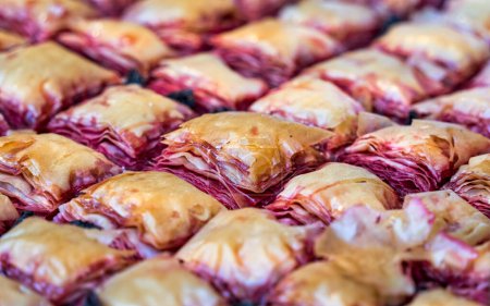 Close up detail with traditional cherries baklava. Asian sweet dessert