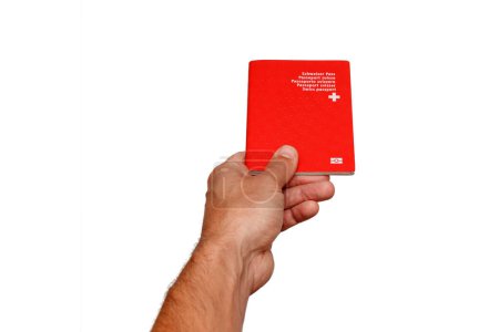 Foto de Man holding swiss passport identification on white background. Immigration, travel or Citizenship concept. - Imagen libre de derechos