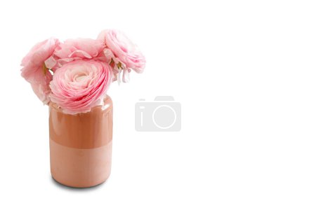 Bunch of pink flowers in vase on white background.