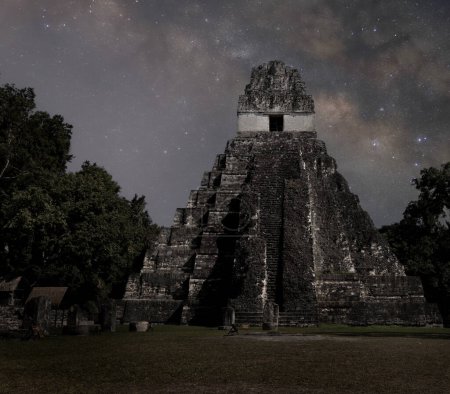 Temple 1 or jaguar milky way at night in tikal guatemala. Ancient mayan temple ruin with starry nightsky.