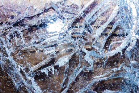 Photo for Close up photo texture of frozen and cracked ice on wood surface. - Royalty Free Image