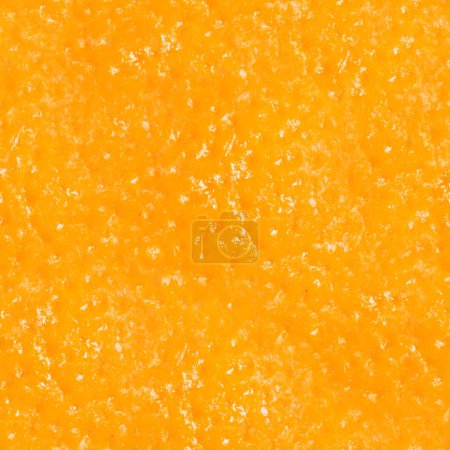 Seamless photo texture of orange fruit peel.